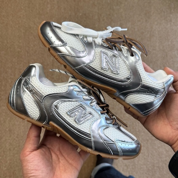 New Balance Silver and White Sneakers